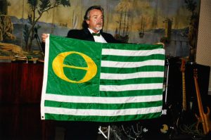 Marc McGinnes holding the Ecology Flag